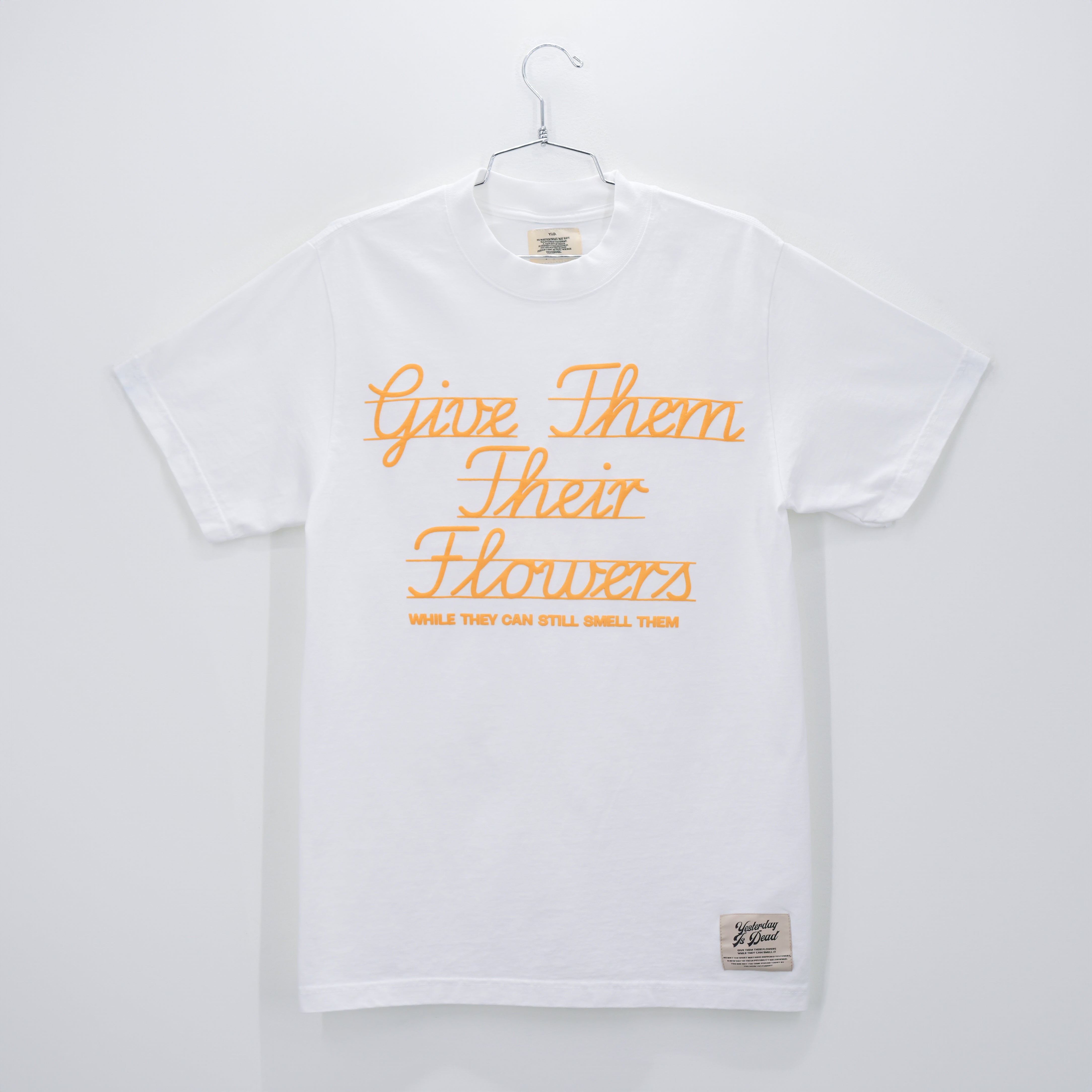 GIVE THEM THEIR FLOWERS SPELL OUT TEE WHITE